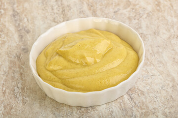 Organic mustard sauce in the bowl