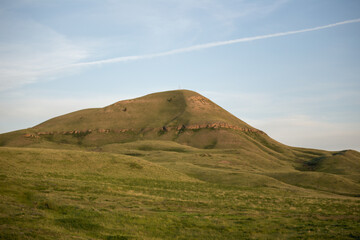 Grassy green mountain in Belt, Montana, USA.