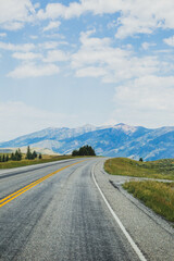 Curved road leading to mountains