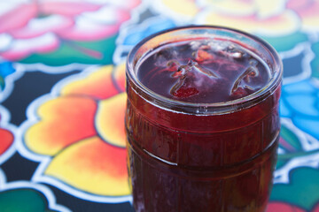 Jamaica (hibiscus) Agua Fresca Drink on a table at an Oaxacan restaurant bar in Oaxaca City, Mexico.