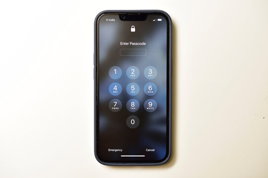 New Delhi, India - June 22, 2022: Locked iphone required passcode isolated on white background