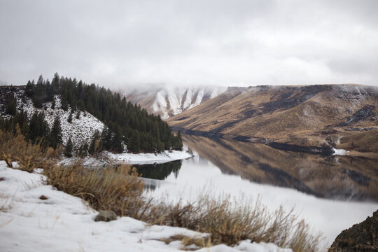 River with snow dusted hill sides