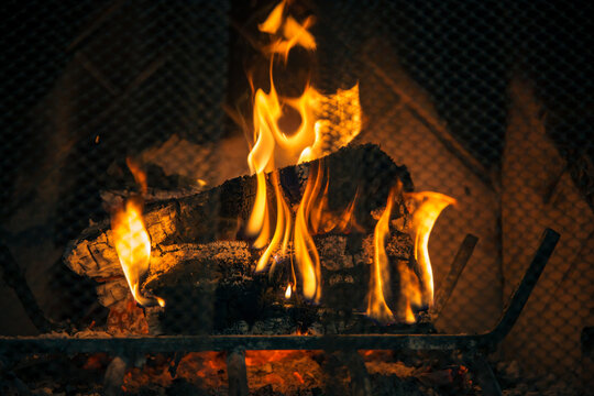 Fire burning in dark fireplace