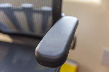 Office chair arm rest close up - obrazy, fototapety, plakaty