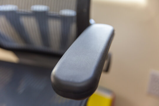 Office chair arm rest close up