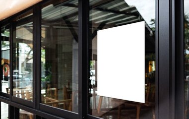 White paper poster mockup displayed outside the building restaurant. Marketing and business concept.