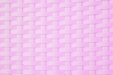 Texture of a pink wicker basket weave
