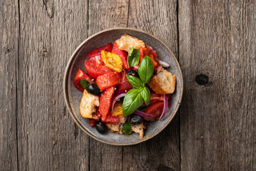 Italian panzanella salad with tomatoes and bread, view from above