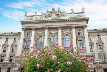 historic justice court at Karlsplatz munich, Justizpalast. blooming rose bush