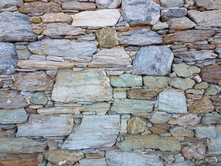 wall of rocks in andros island greece