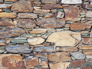 wall of rocks in andros island greece