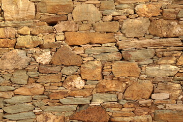 wall of rocks in andros island greece