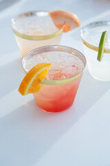 A view of some cocktails in plastic cups, seen at a local catered event.