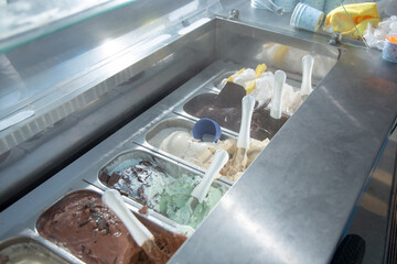 A view looking inside the freezer container of a gelato cart, seen at a local catered event.