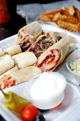A view of an entree featuring shawarma wraps.