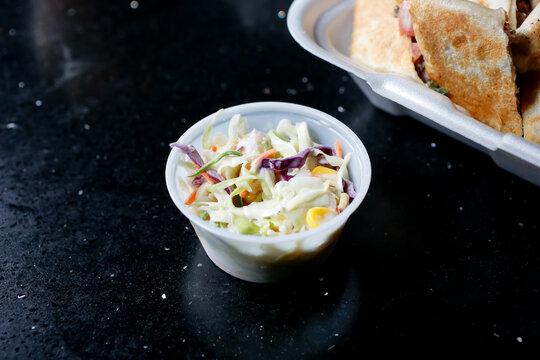 A View Of A Condiment Cup Of Coleslaw.