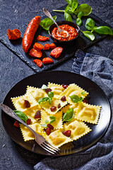 italian ravioli with chorizo ricotta filling on plate