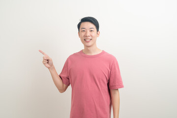 Asian man with hand pointing or presenting on white background