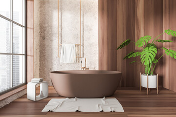 Light bathroom interior with bathtub and accessories, panoramic window