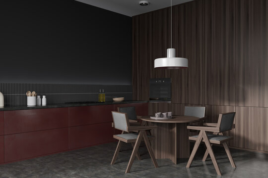 Stylish kitchen interior with eating corner with table and kitchenware