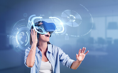 Smiling woman in vr headset working in metaverse, digital hologram