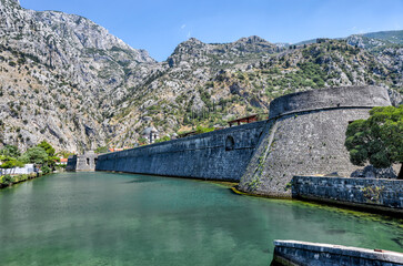 Obraz na płótnie Canvas Kotor, Montenegro - July 18, 2022: Old town and medieval walls of Kotor, Montenegro 