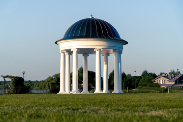 Rotunda in the park at sunset time - obrazy, fototapety, plakaty