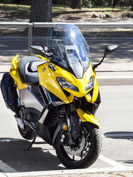 Yamaha TMax yellow sports scooter. Milan - Italy, 20 August 2022