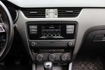 Obraz na płótnie Canvas View of dashboard with multimedia system in modern car. Modern car dashboard. Screen multimedia system. 