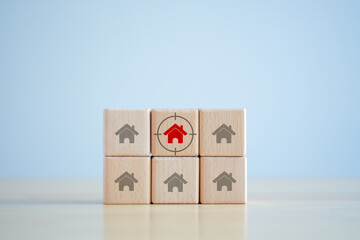 Real estate. House and property investment and asset management concept. Buy, Rent, Interest rates, Loan mortgage, Tax. Red house icon on wooden block with focus frame. Decision for buy or rent home.
