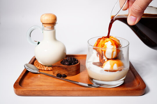 Affogato Coffee Espresso in a glass jar with vanilla ice cream close-up (spot focus)
