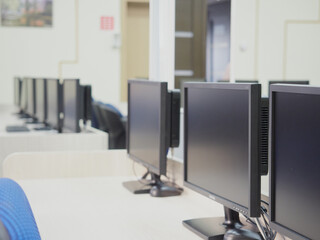 The control room of the city surveillance center. Computer monitors show cameras all over the city.