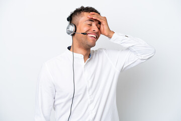 Telemarketer Brazilian man working with a headset isolated on white background has realized something and intending the solution