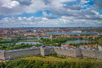 Fototapeta na wymiar Copenhagen canals and city view. Danish rooftops cityscape.