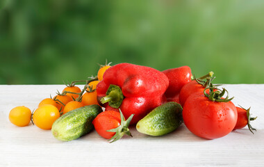 Fresh food on a wooden table, blurred natural background. Local market for fresh vegetables, garden products, clean food and diet concept
