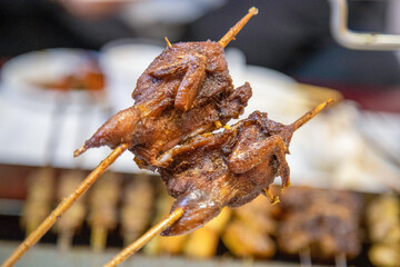 Chinese night roadside barbecue - grilled quail meat