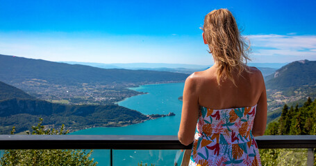 woman enjoying Annecy lake panoramic view