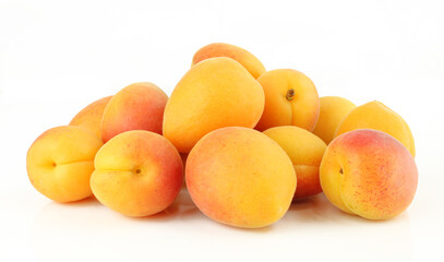 Pile of whole apricots isolated on white background.Ripe sweet fruit