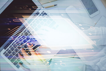 Obraz premium Double exposure of woman hands working on computer and data theme hologram drawing. Top View. Technology concept.
