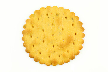 One salty cracker isolated on white background. Round biscuit with holes