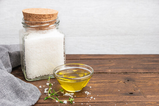 Olive Oil With Thyme And Salt Flower On Wooden Background.