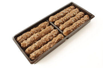 Chocolate coated wafer sticks in plastic package isolated on white background