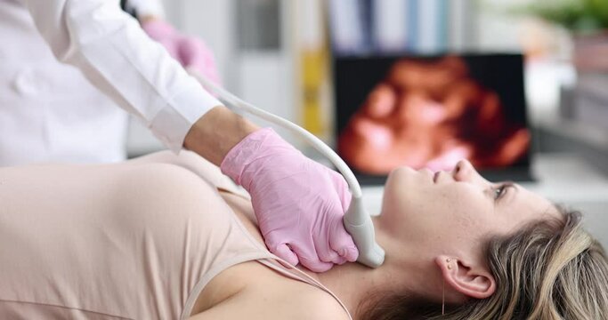 The doctor in the process of ultrasound of the neck