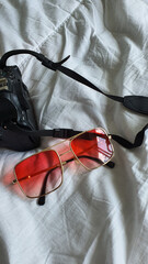 red sunglasses on a white background.red glasses on a white background.glasses close-up.red glasses close-up.sunglasses