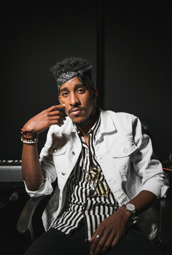 Portrait of confident black man with a headscarf