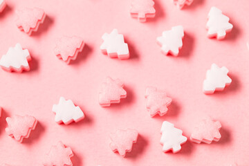 Christmas tree candy with pink background