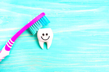 Colorful toothbrush cleaning a cute tooth character