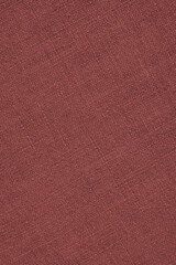 Brown woven surface close-up. Linen net texture. Dark fabric len background. Textured braided vertical backdrop. Sewing and handicraft