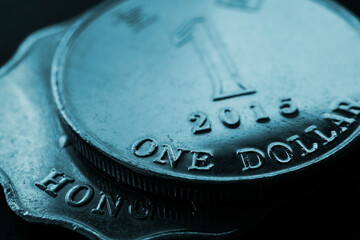 1 one Hong Kong dollar. Fragment of textured coin. Blue tinted background about economy or finance. Coins and money of Hong Kong. News about banks and currency. Budget and taxation. Macro