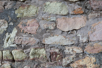 Background from an ancient stone wall. Old wall with stone pattern